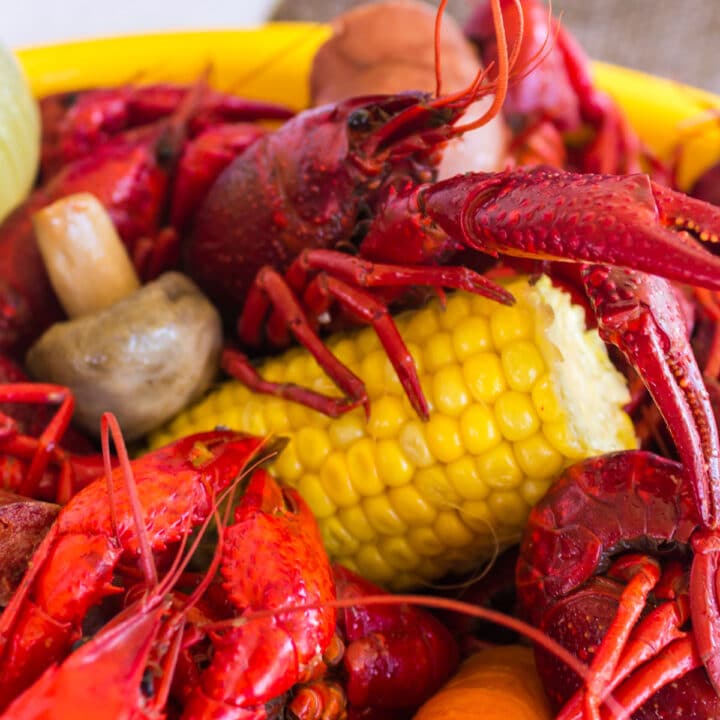 close up of crawfish with corn and mushroom and carrots