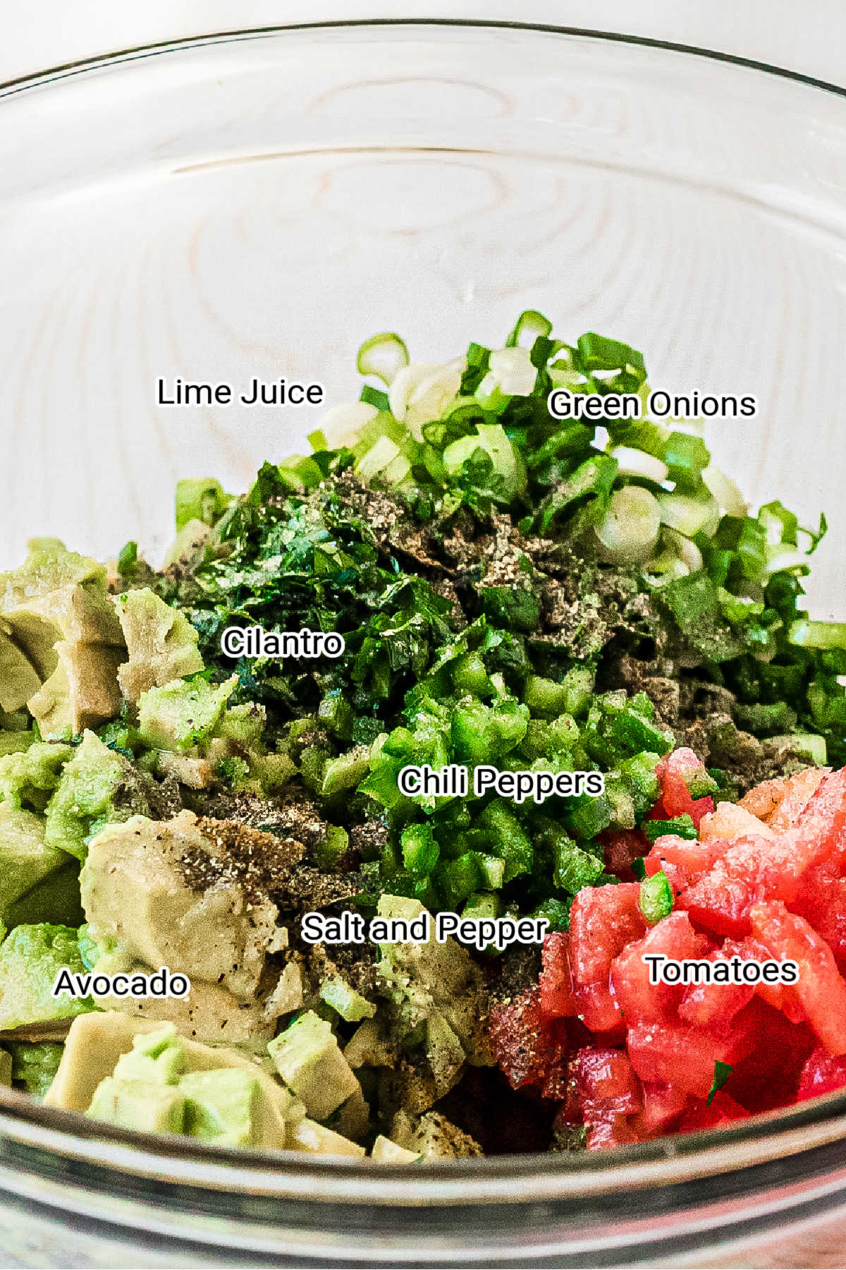 close up of guacamole ingredients in a bowl