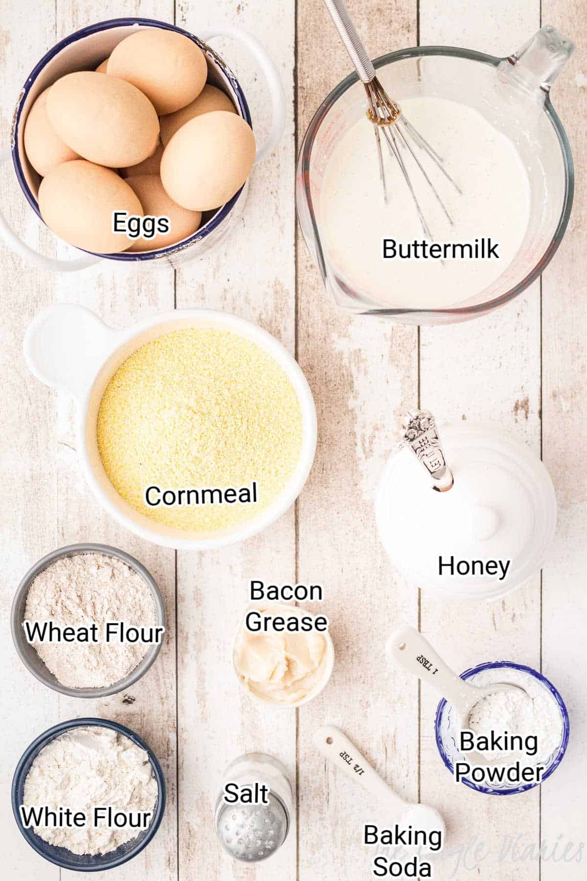 ingredients laid out and the names printed over, for making a skillet cornbread