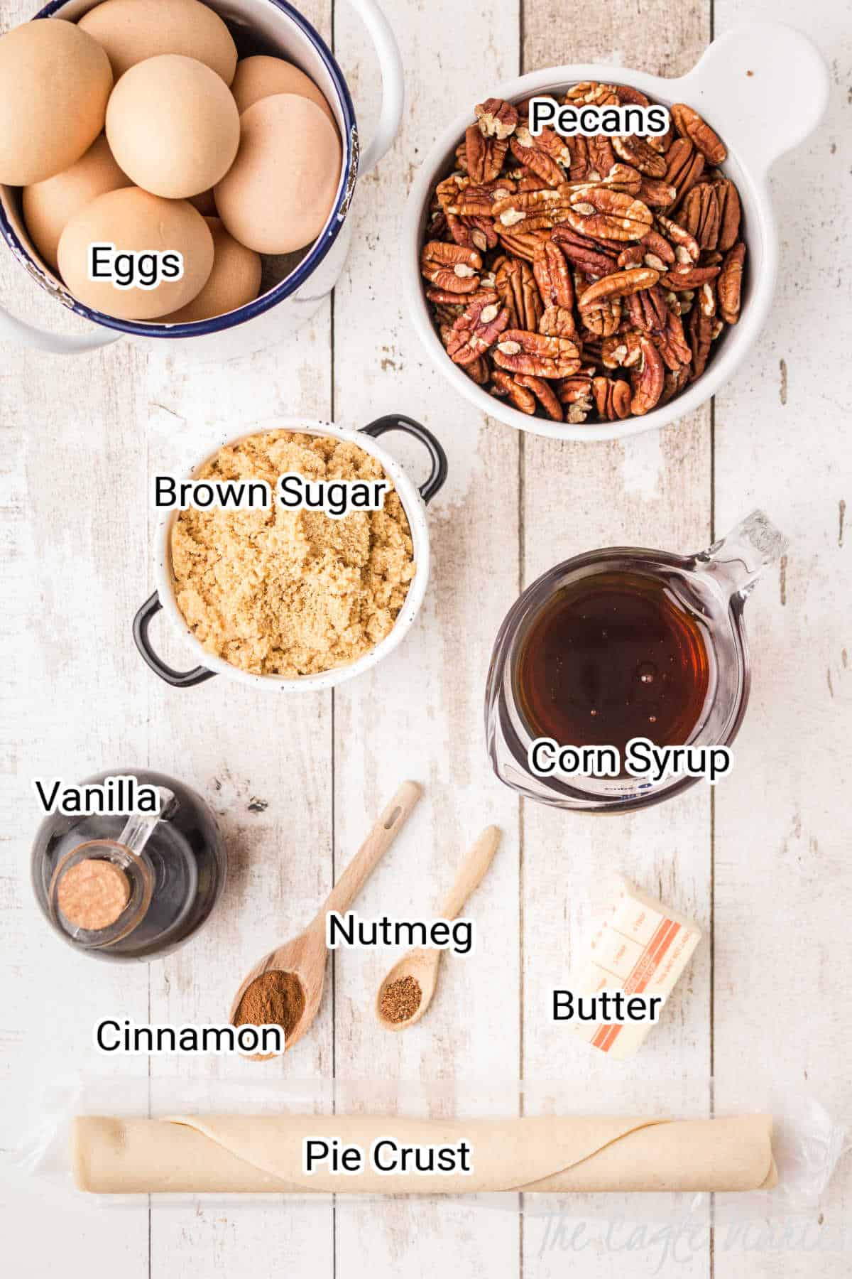 pecan pie ingredients laid out with the words on top