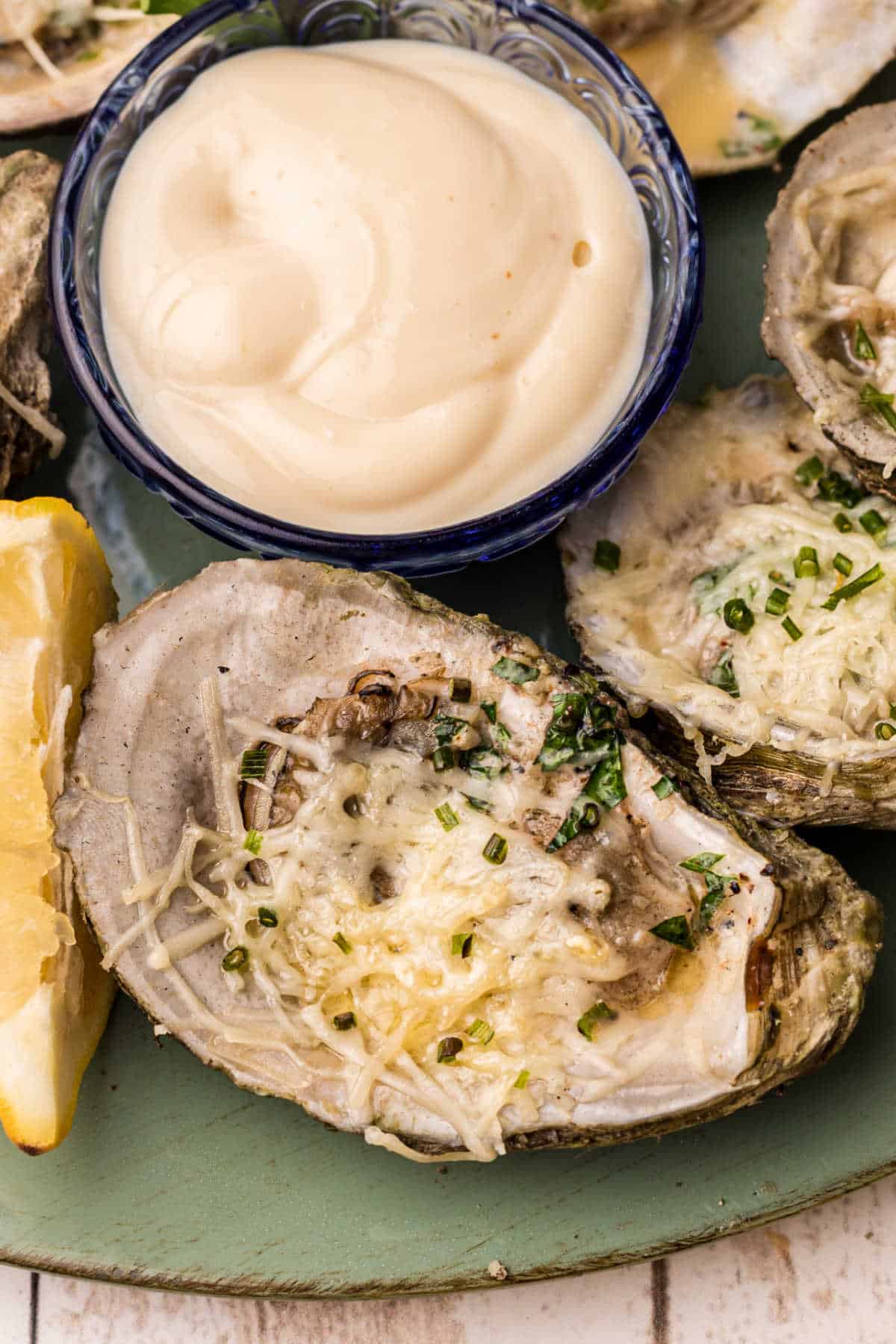 close up of a chargrilled oyster with cheese