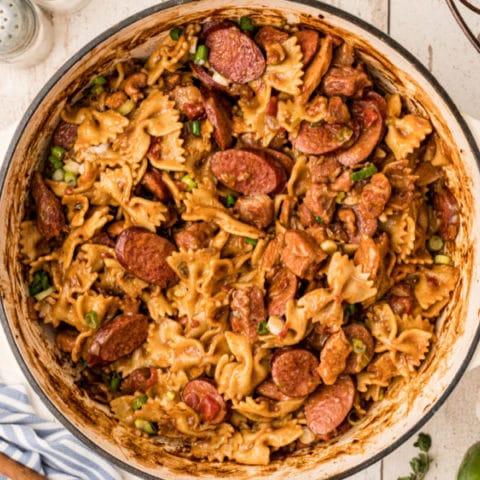 Pot filled with pastalaya, in the middle of the image with sausage and noodles