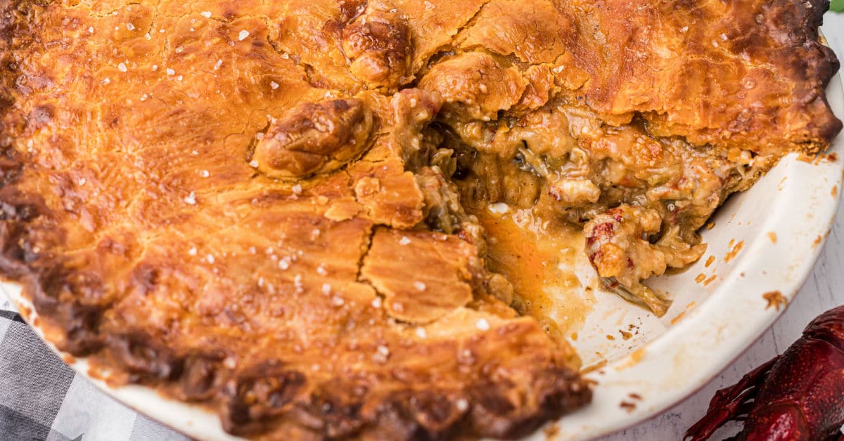 a crawfish pie with a slice taken out showing you the inside
