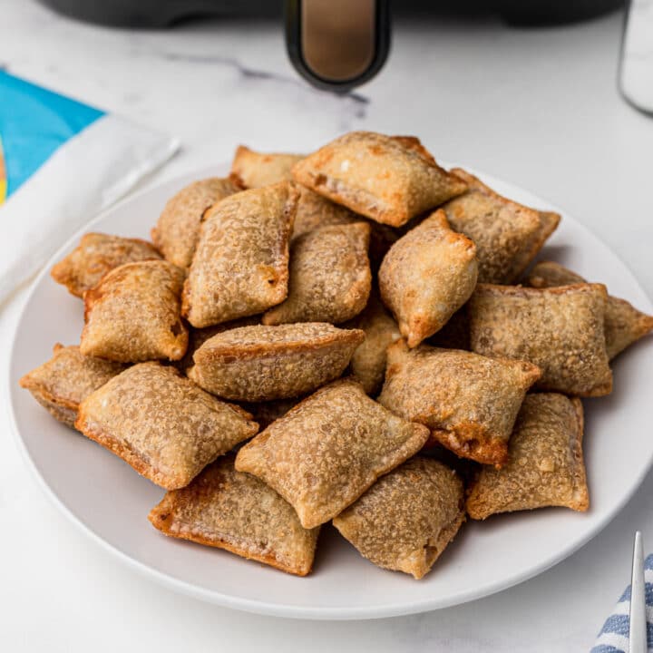 a plate full of air fryer pizza rolls