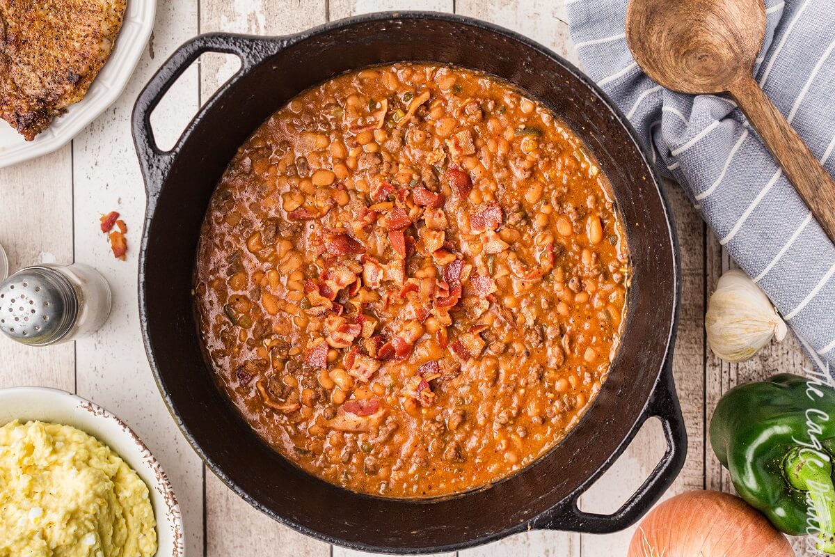 cast iron pot of baked beans with bacon