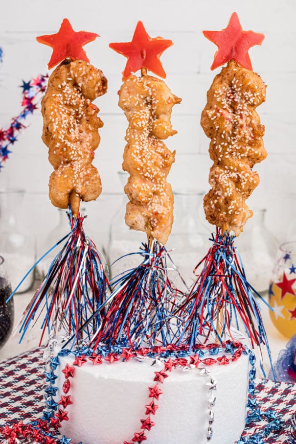 Some fried shrimp on a skewer, made to look like firework rockets.