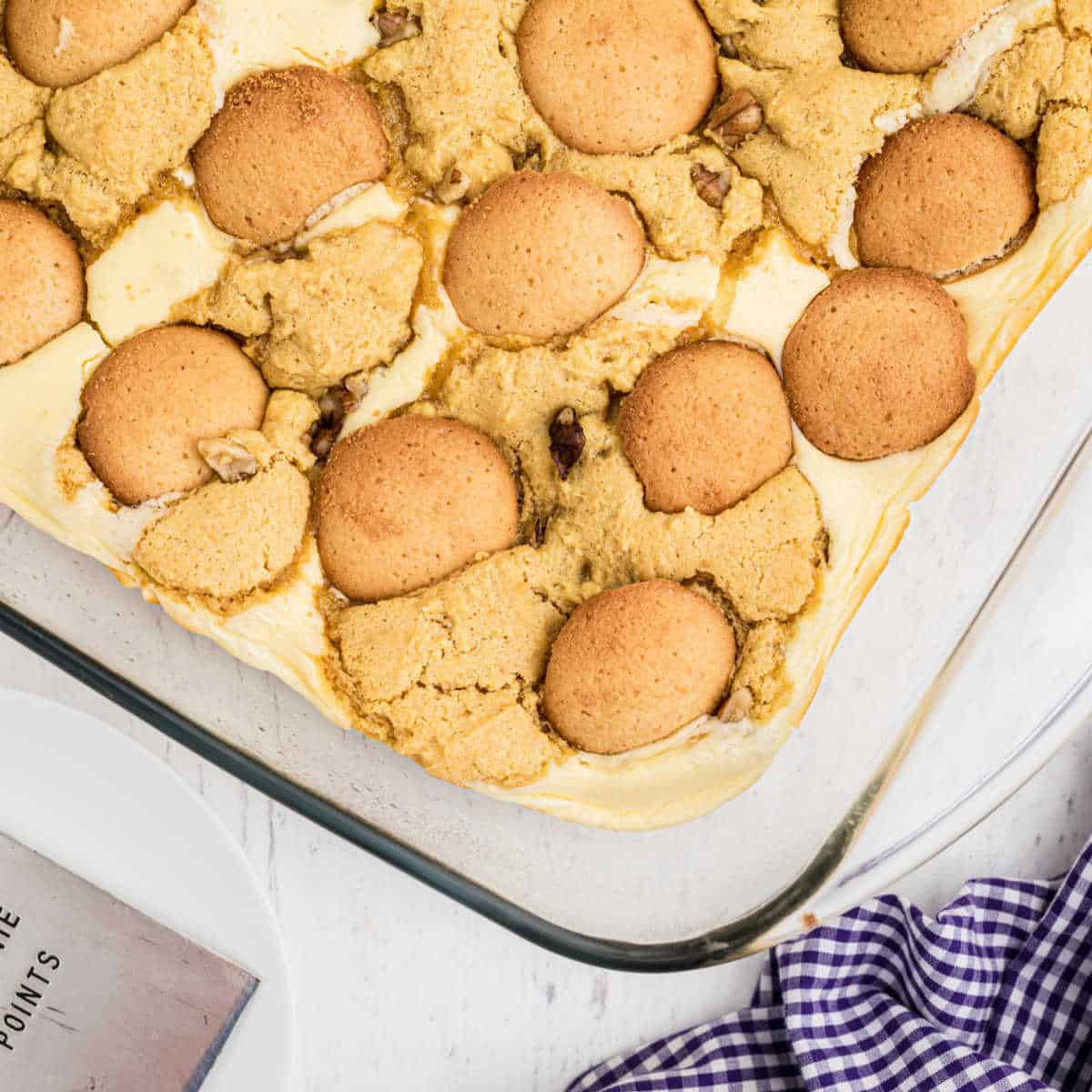 a close up of a finished banana pudding brownies with vanilla wafers on top