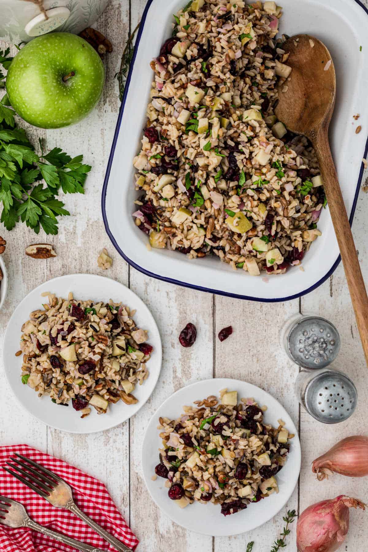 dished out rice pilaf with cranberries with a spoon in the serving dish