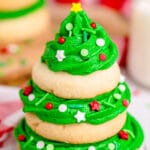 image of a stack of sugar cookies with green frosting that makes it look like a christmas tree
