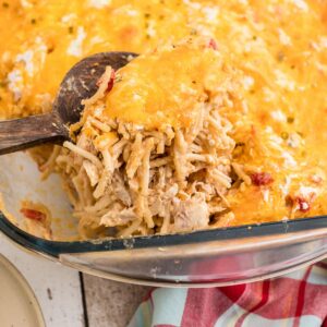 close up of a chicken spaghetti with a spoon digging into it