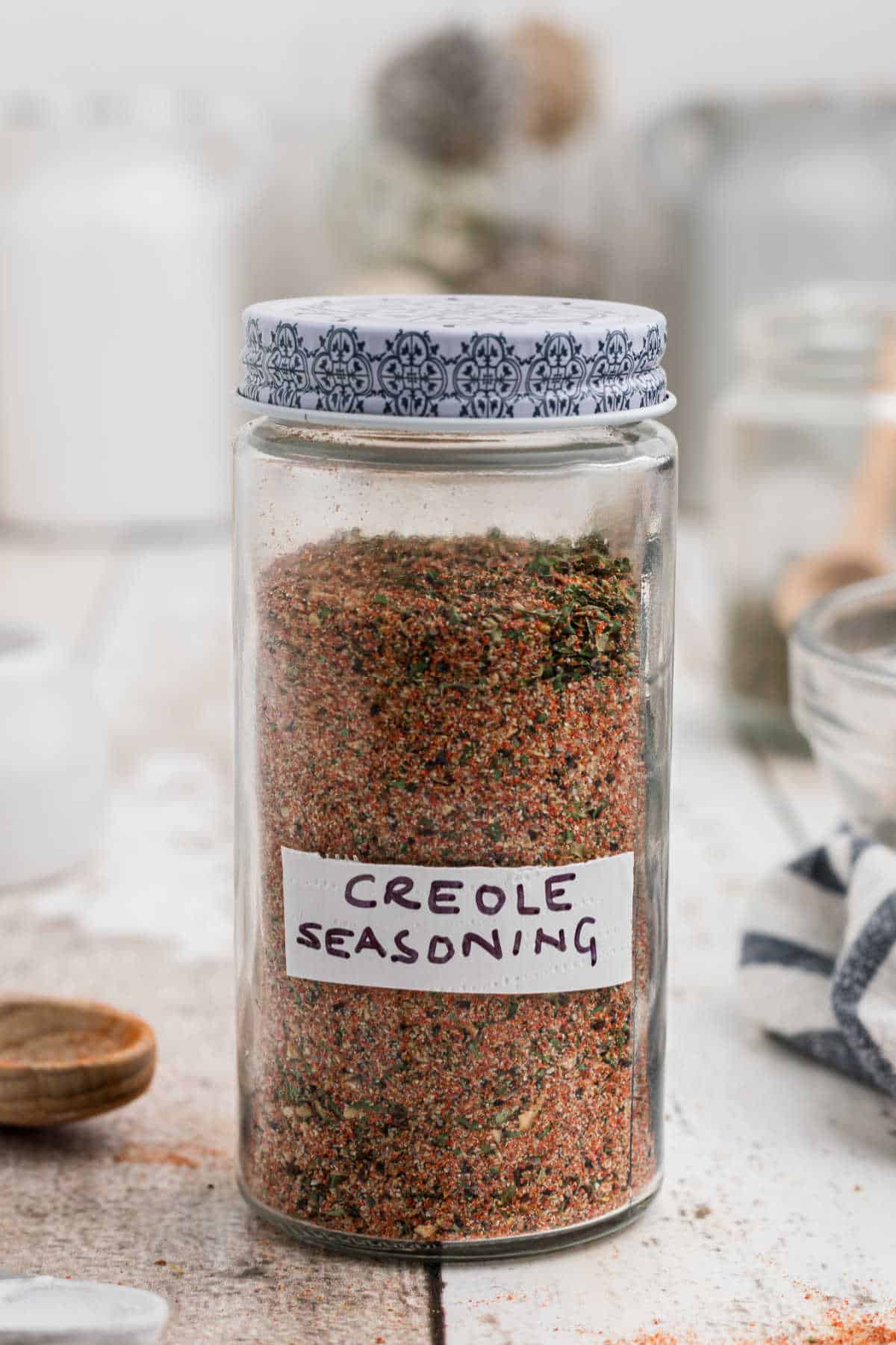 a jar of seasoning with a label on the front that reads Creole Seasoning