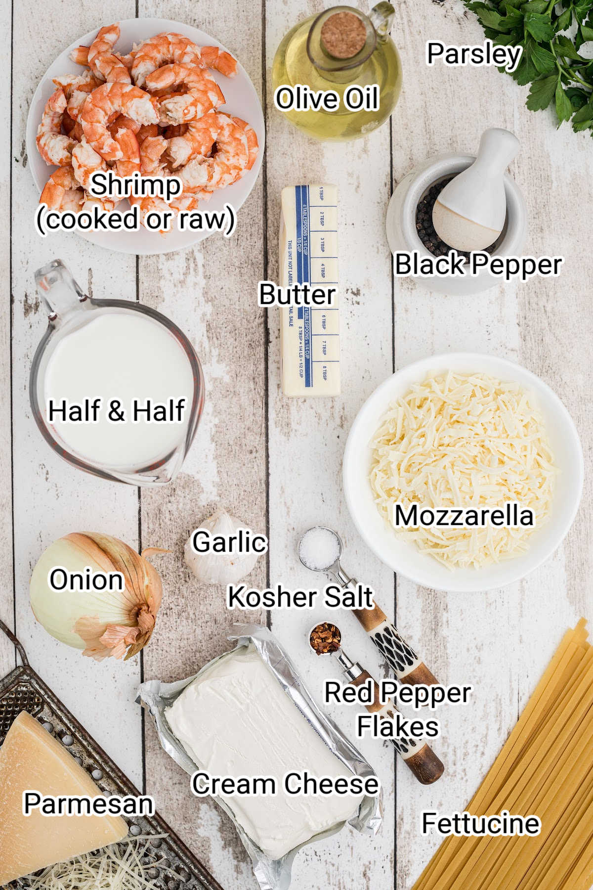 laid out ingredients that are in a shrimp alfredo bake with the names typed over