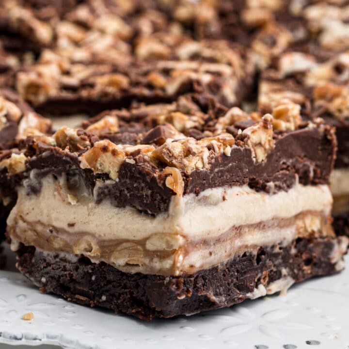 very close up image of a snickers brownie with nuts on top
