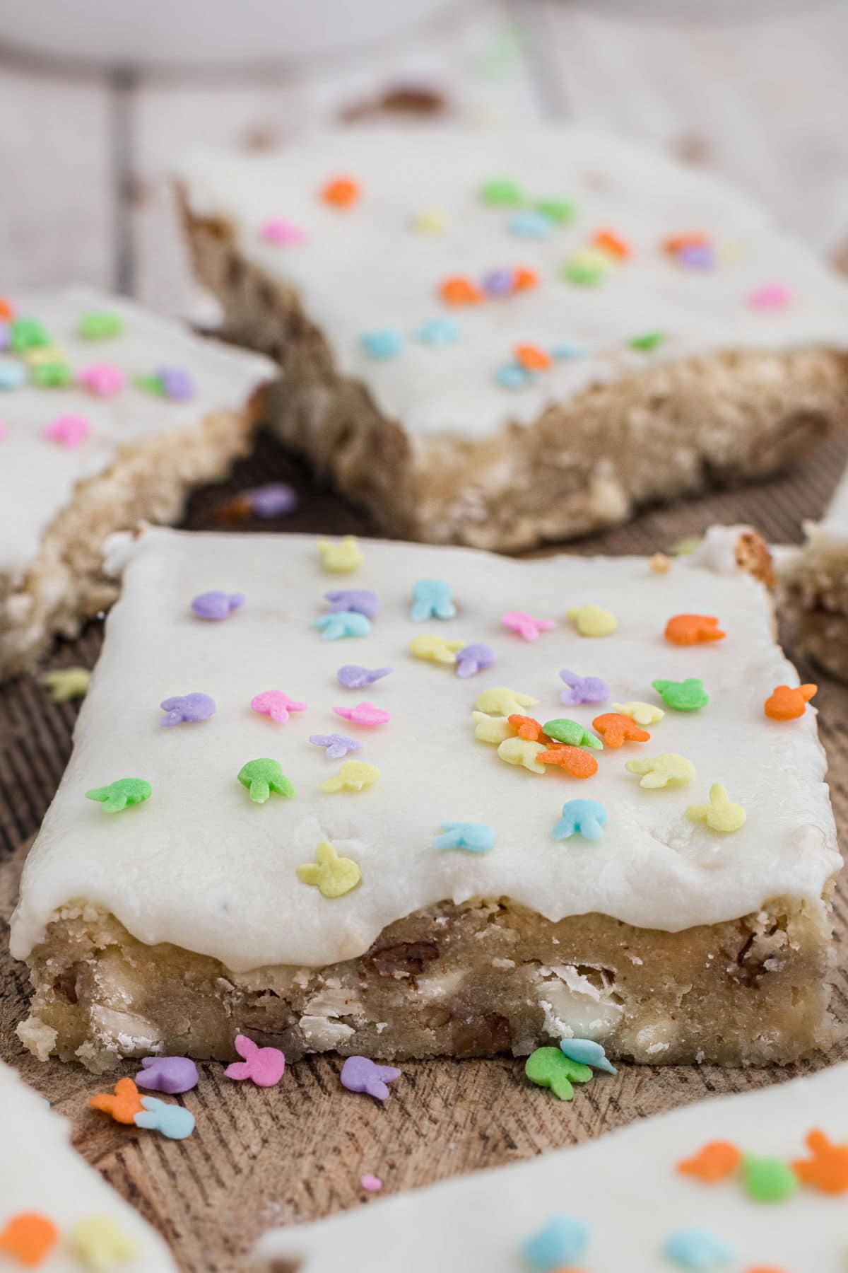 vanilla brownies with a white glaze on top with Easter bunny sprinkles