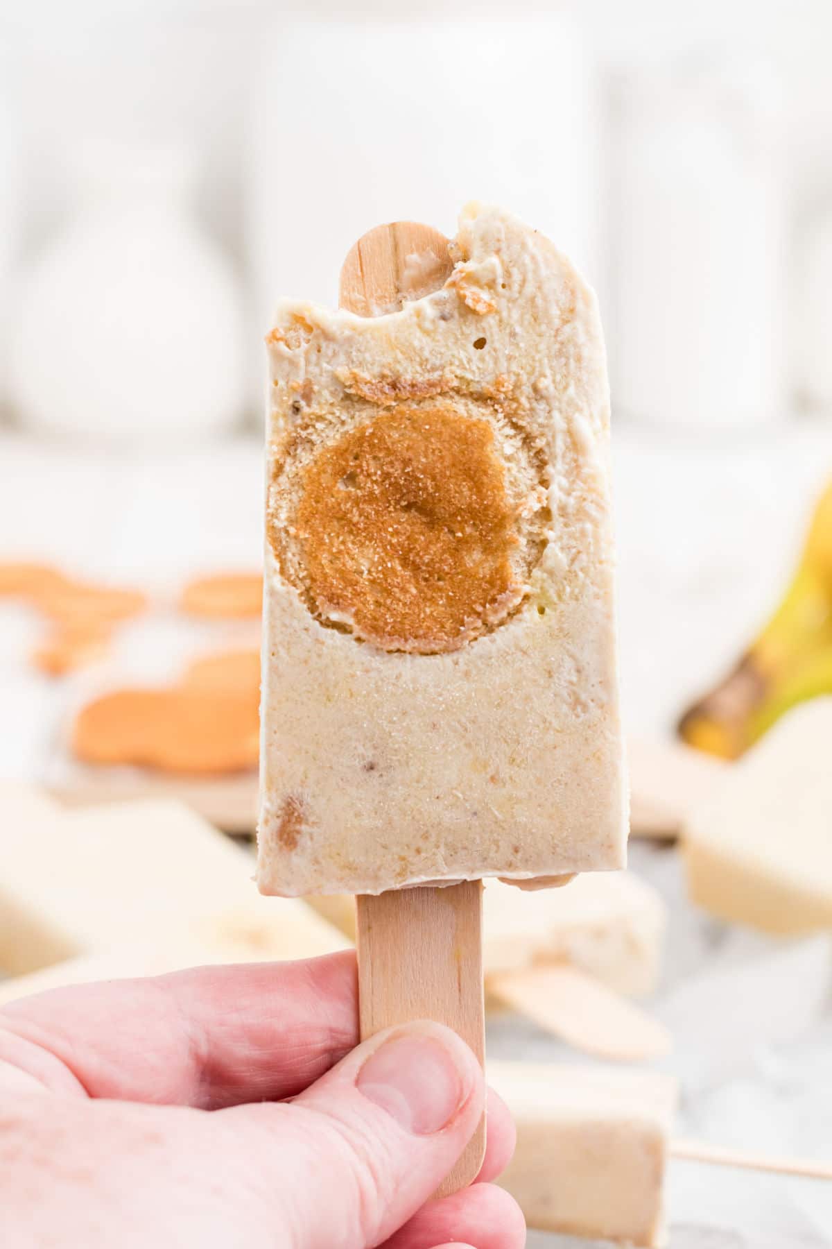 close up of a banana pudding popsicle with a bite taken out of it