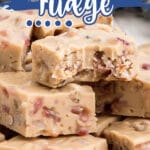 A close up shot of maple bacon fudge with a bite taken out of it.