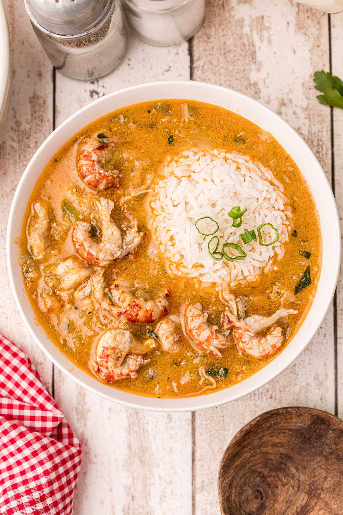 delicious bowl of crawfish etouffee with a scoop of rice on top