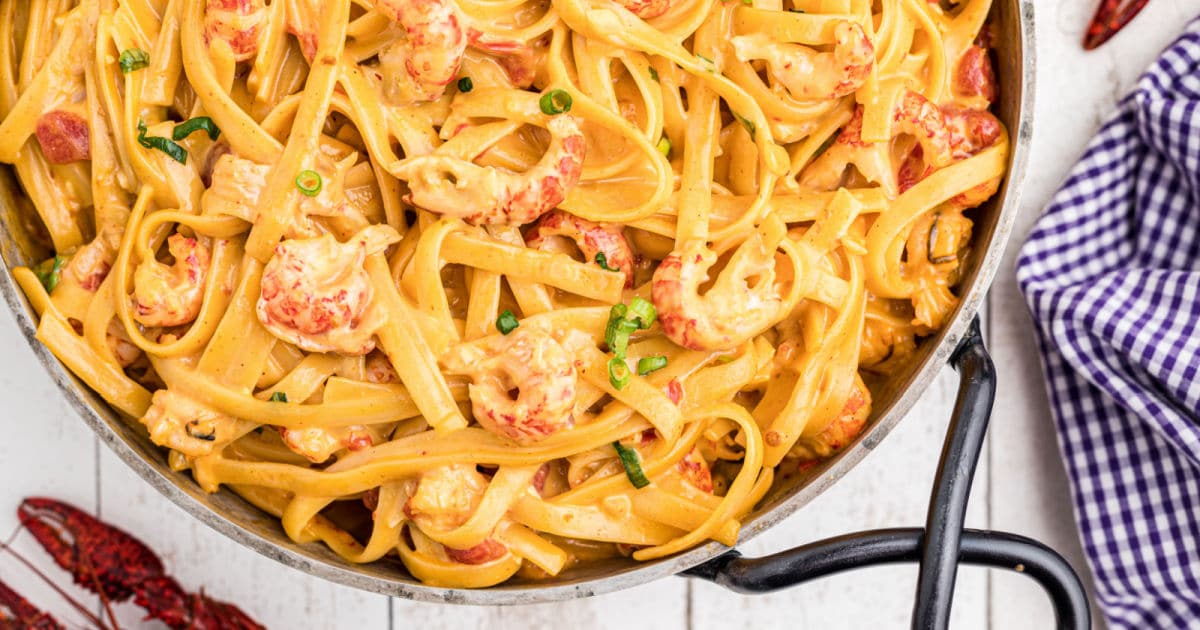 close up of a skillet full of crawfish fettuccine