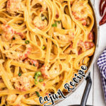 crawfish fettuccine in a skillet close up with the name typed on top
