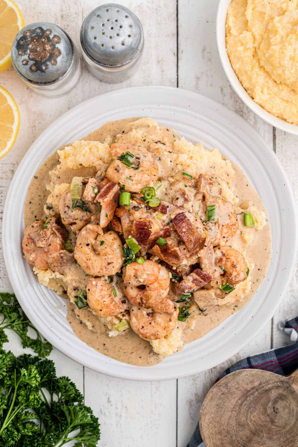 Overhead shot of a plate of Creole shrimp and grits.