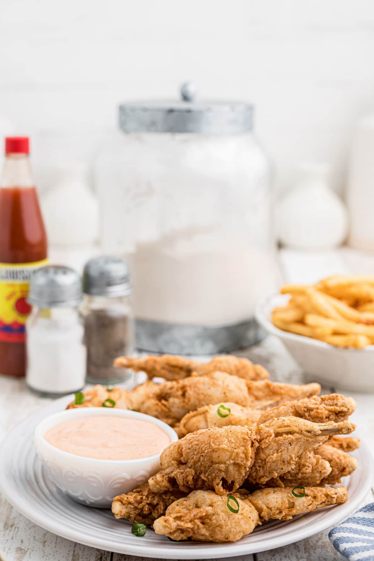 side view of a plate of a plate of fried frog legs