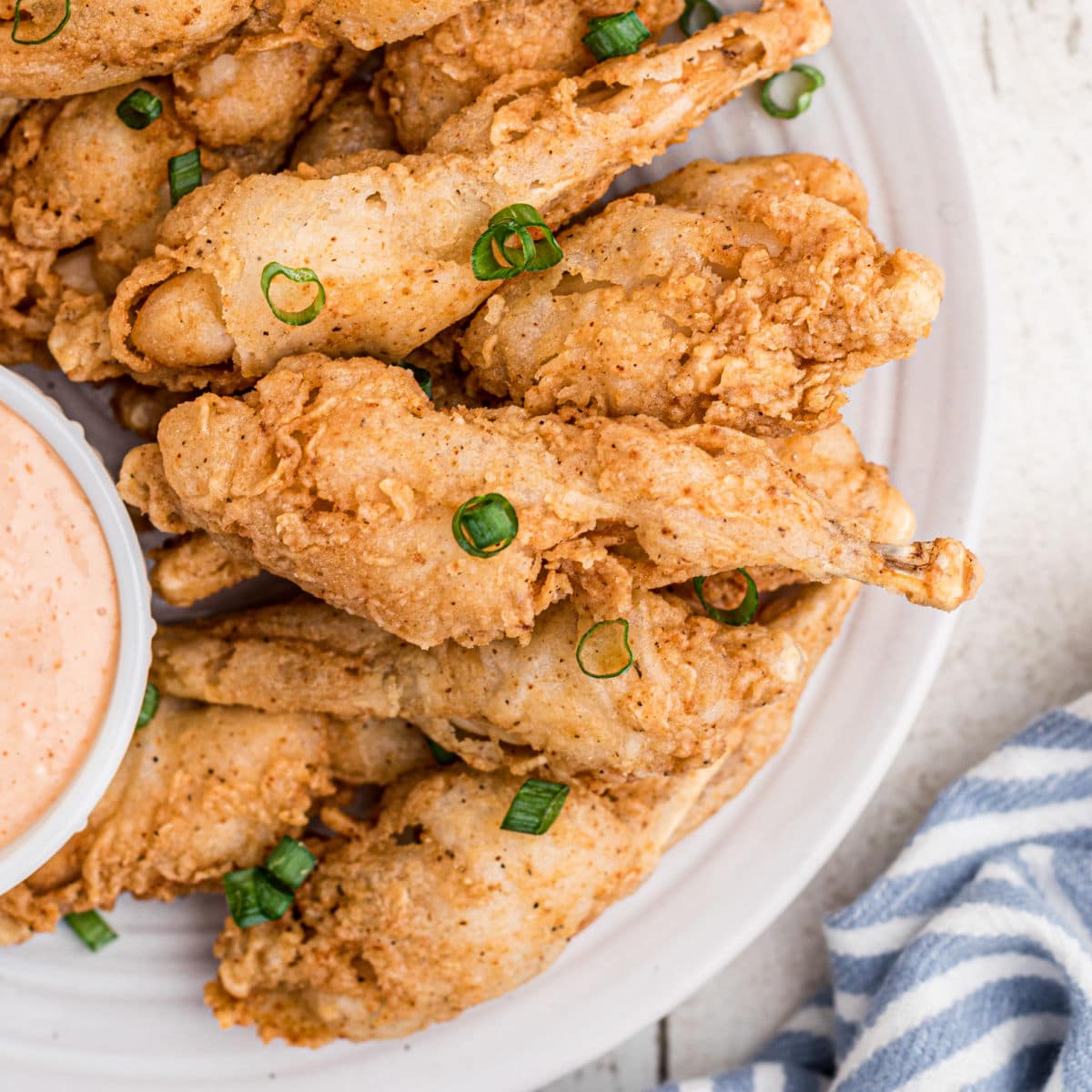 https://thecaglediaries.com/wp-content/uploads/2022/05/Fried-Frog-Legs.jpg