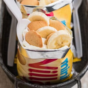 close up picture of a walking banana pudding - a bag of vanilla wafers that has been filled with bananas, cream and pudding