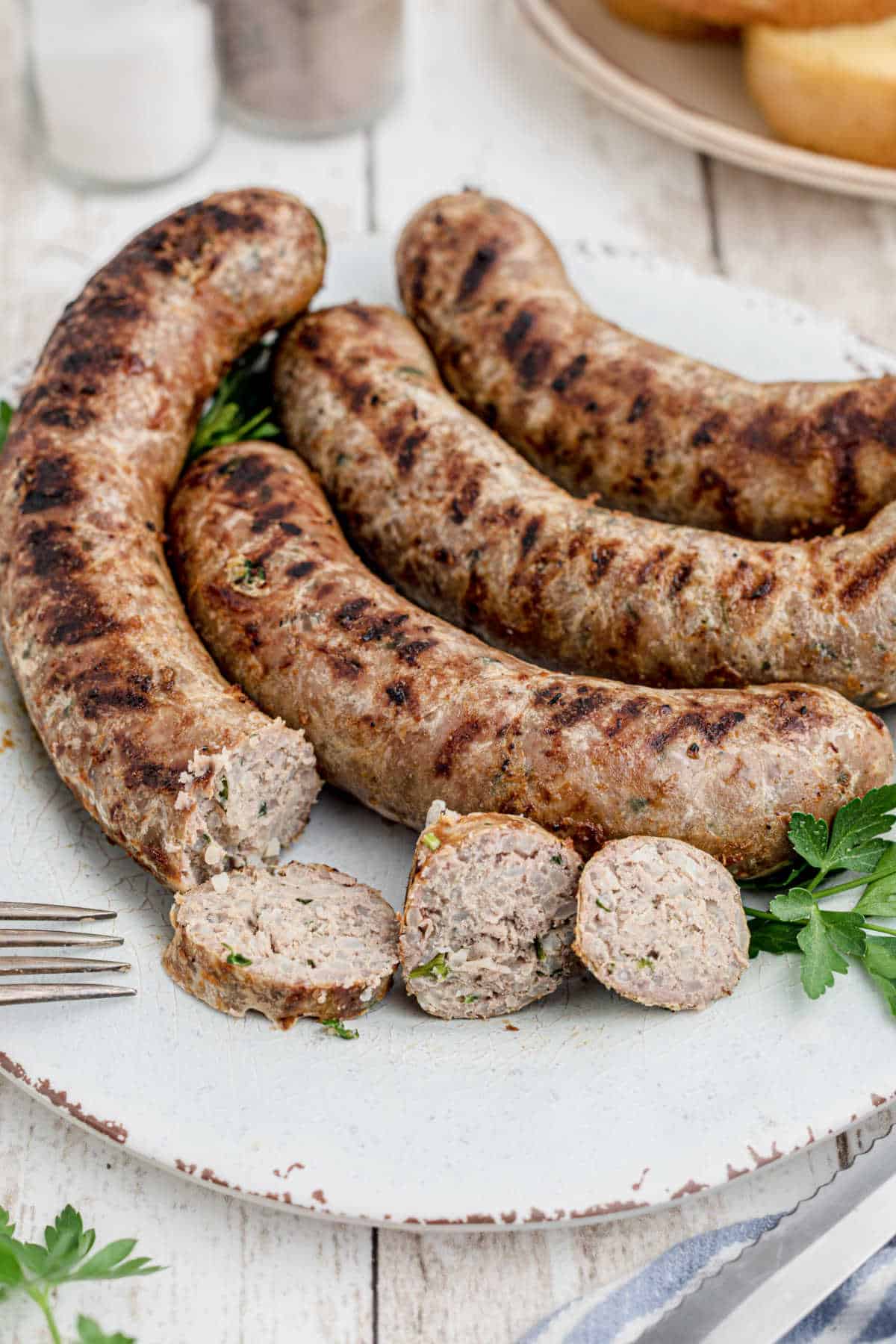 homemade boudin sausage on a plate with a few slices made out of one of them