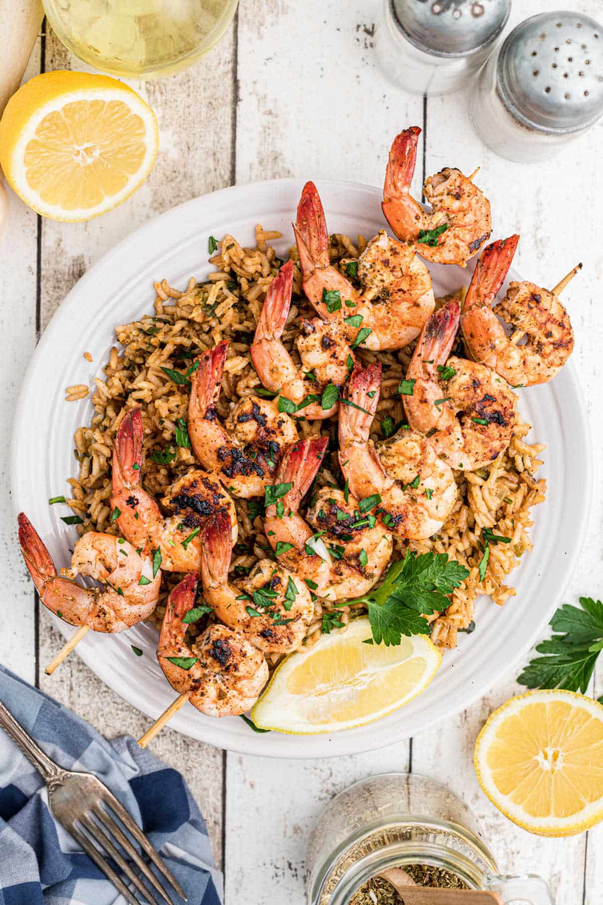 skewers of texas roadhouse grilled shrimp on top of seasoned rice