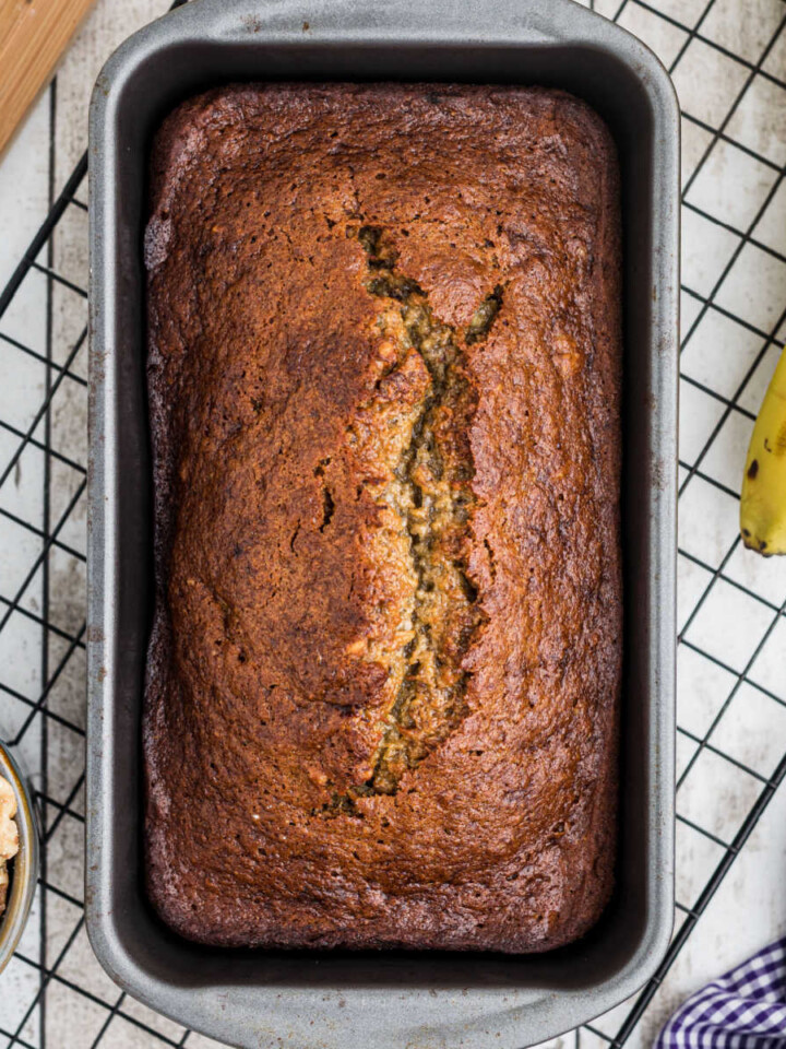 Overhead image of banana bread with mayo in a loaf pan.
