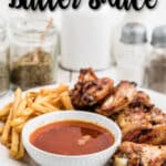 a plate of chicken wings with cajun butter sauce and chicken wings with a pinterest description.