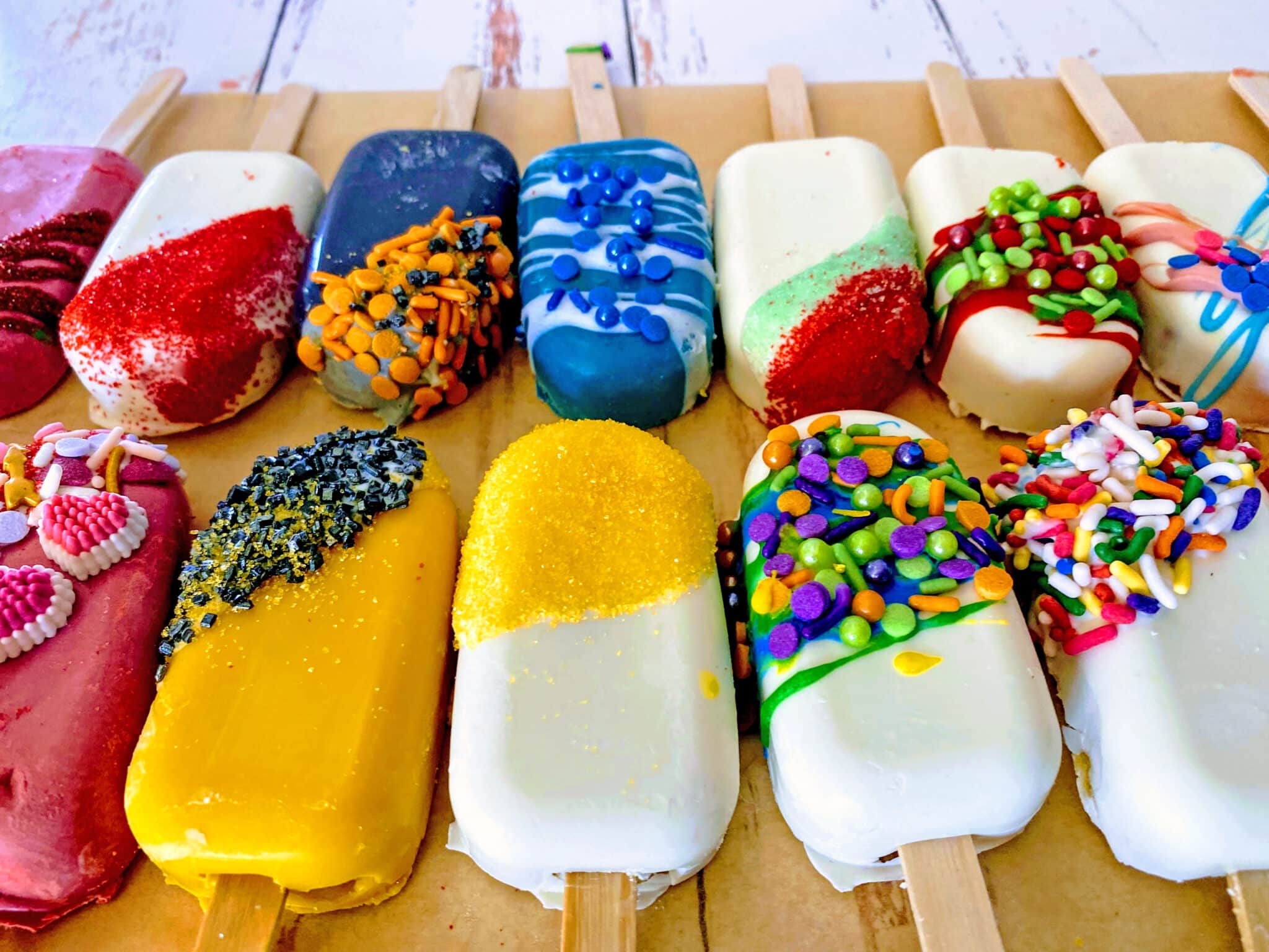 cake popsicles all lined up in a row.