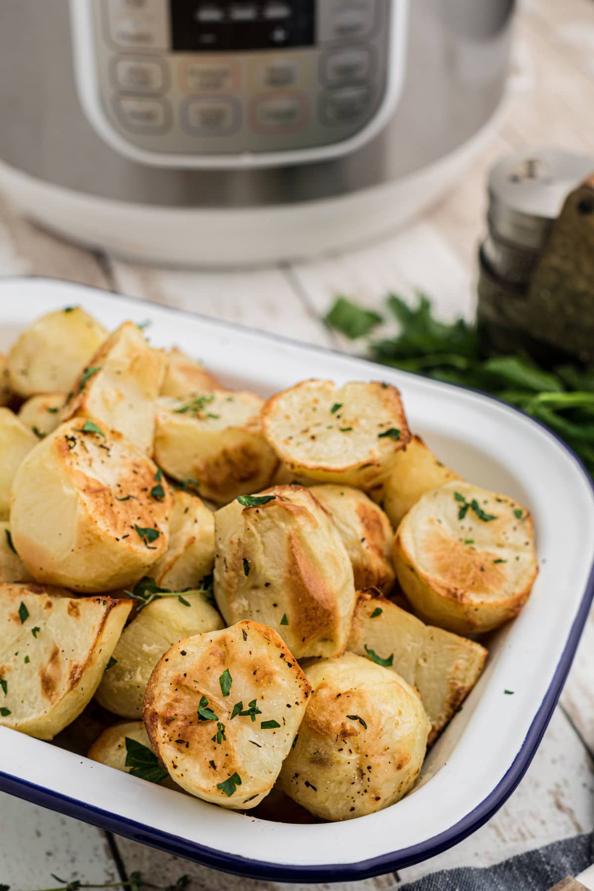 crispy potatoes in front of an instant pot