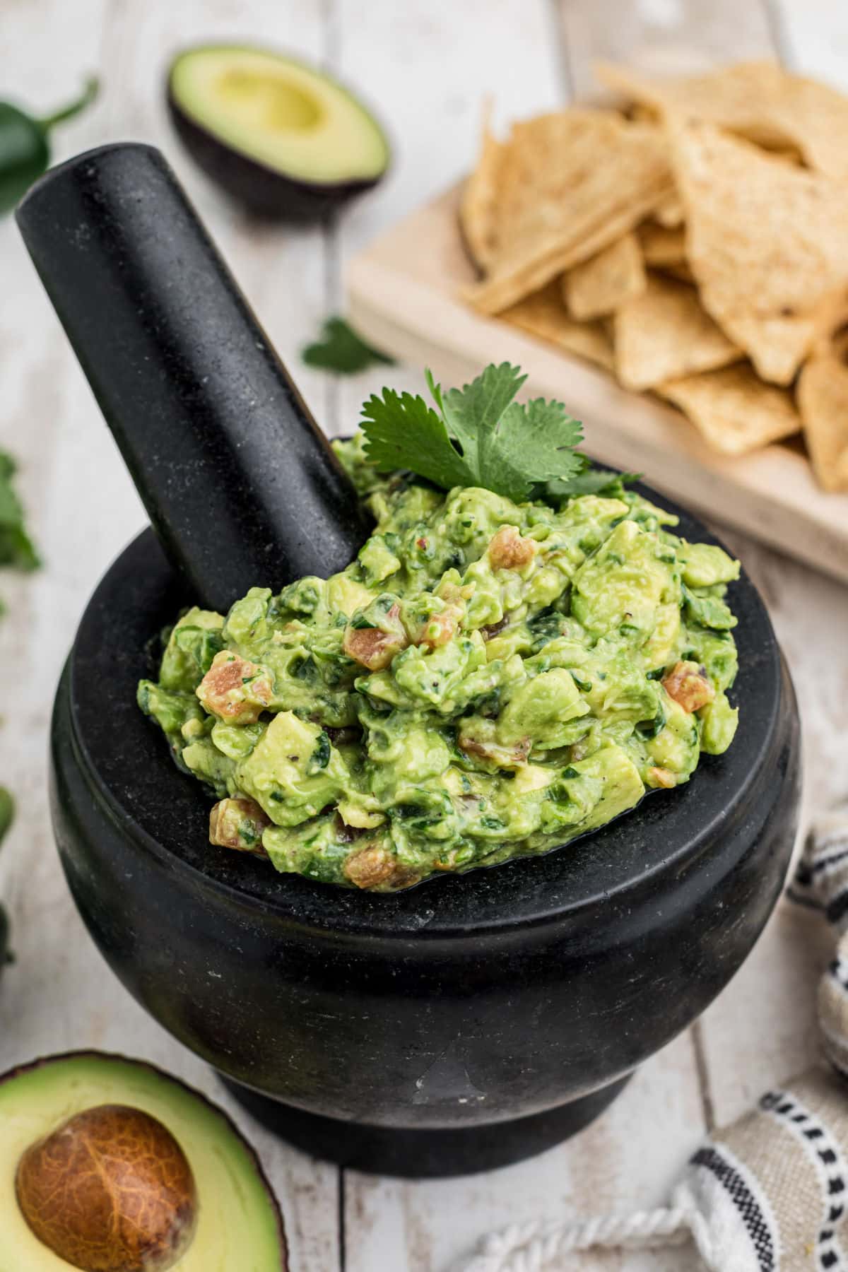 A mortar and pestle filled with guacamole.