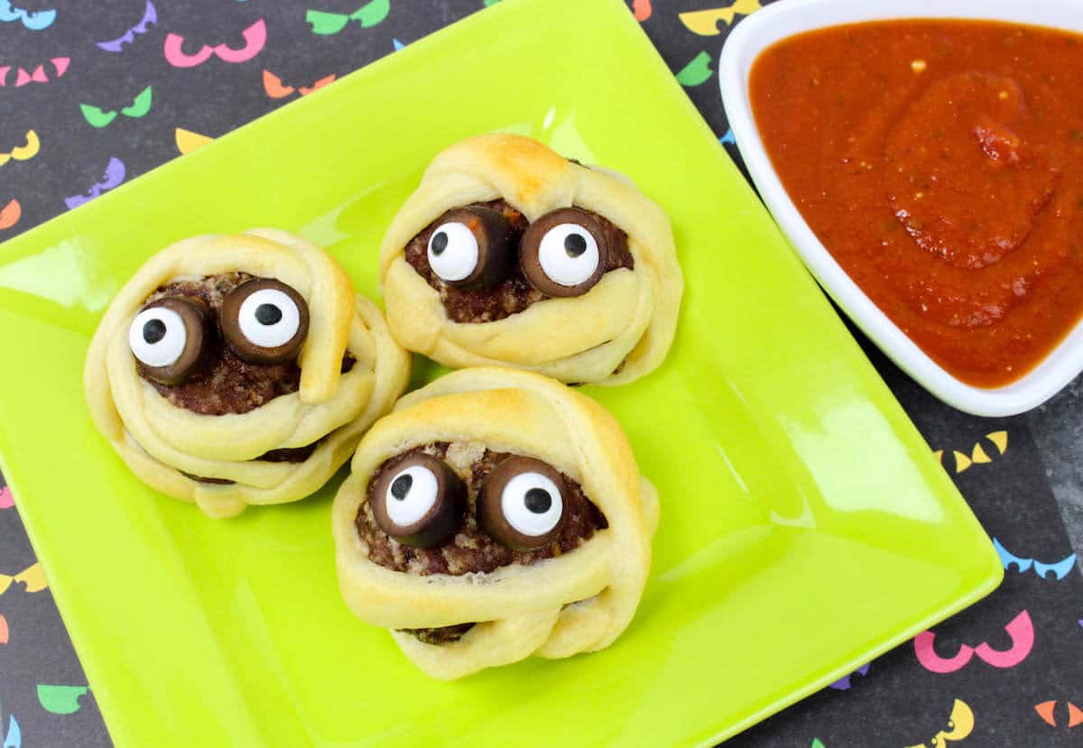meatballs with a little pastry to look like a mummy head with eyeballs