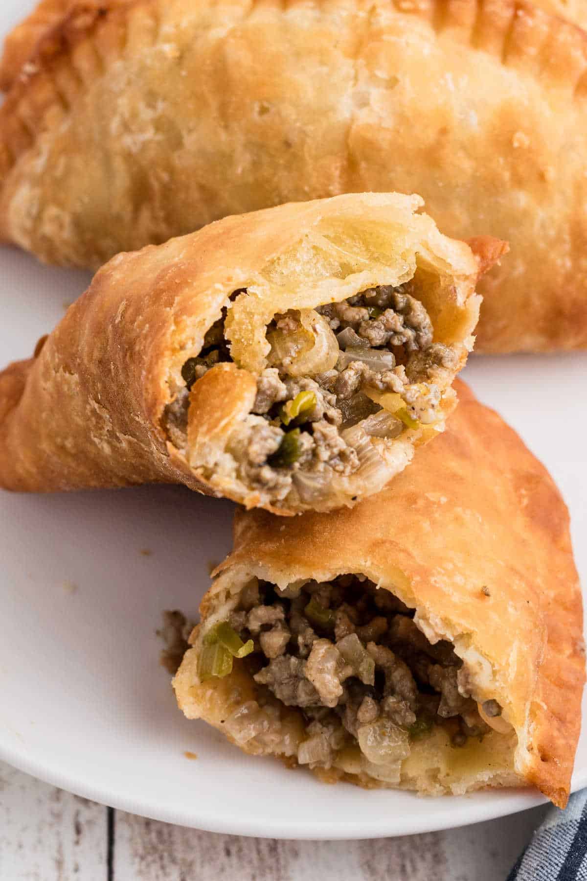 A Natchitoches Meat Pie Recipe image of a pie in half.