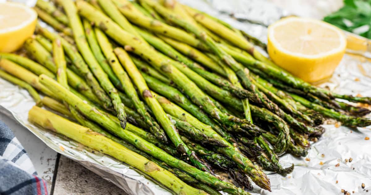 a bunch of smoked asparagus on foil.