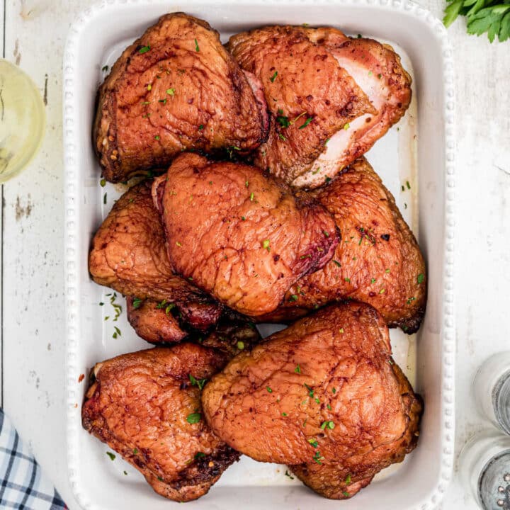 a dish full of smoked chicken thighs