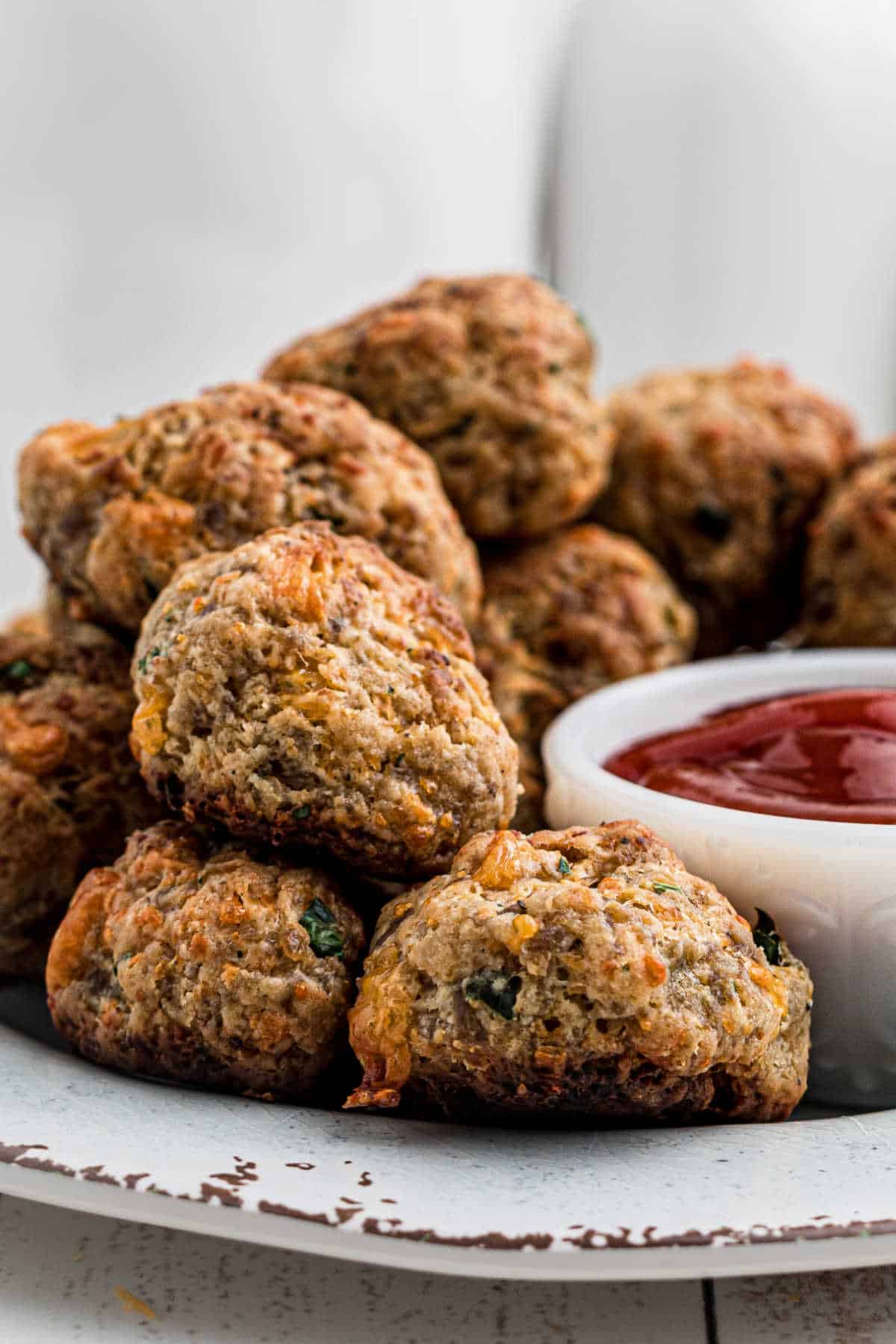 Side view and close up of some sausage balls.