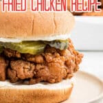 a close up of a fried chicken sandwich with text overlay for Pinterest.
