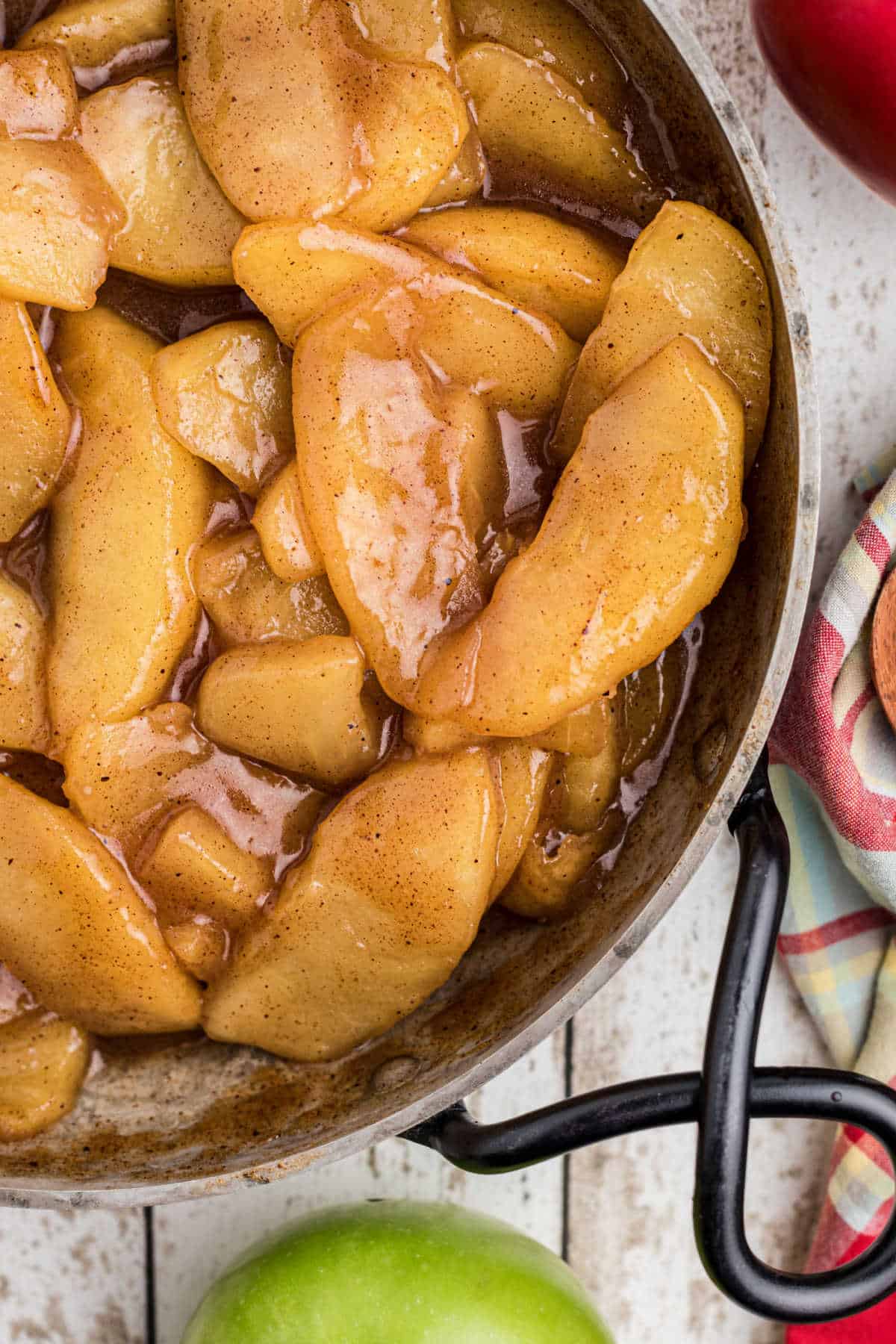 Overhead close up shot of a pan full of fried apples.