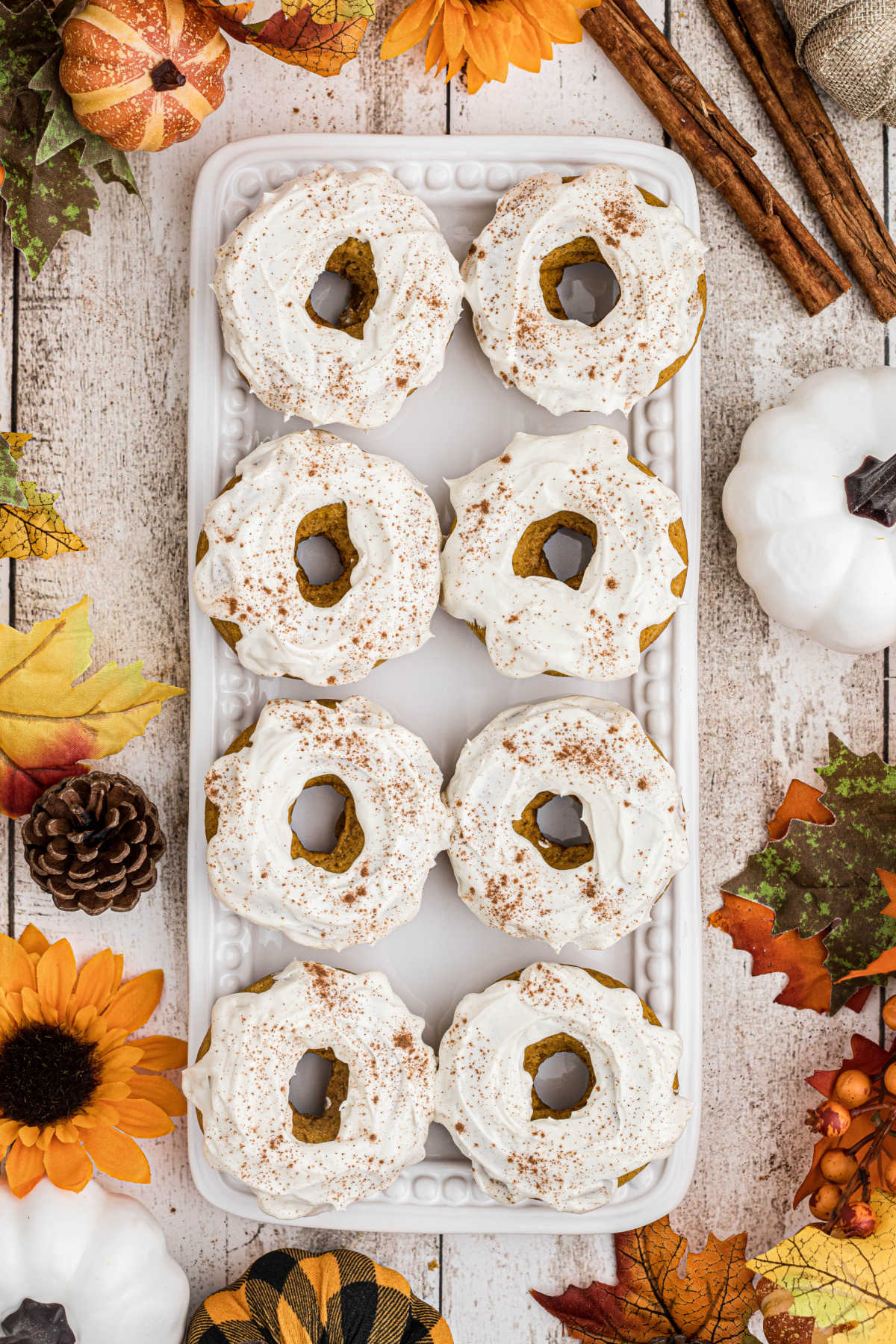 Overhead shot of a plate full of pumpkin spice donuts.