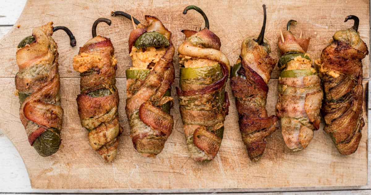 smoked jalapeno poppers lined up.