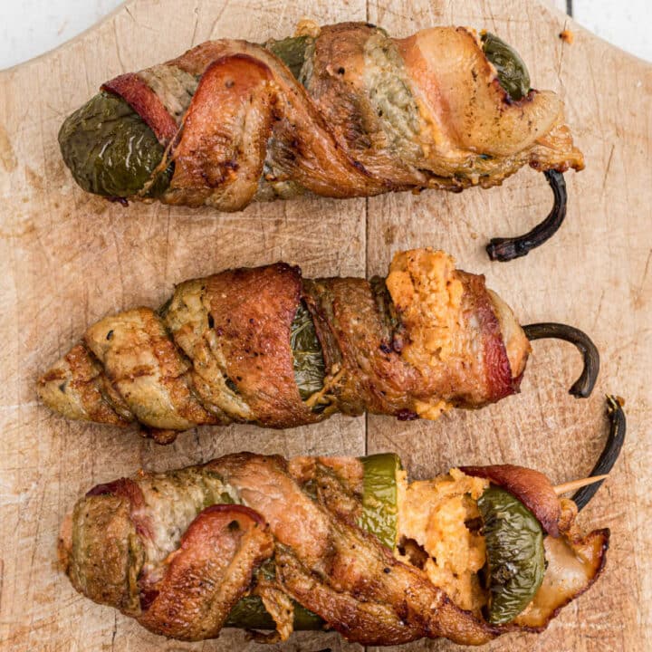 close up of 3 smoked jalapeno poppers.