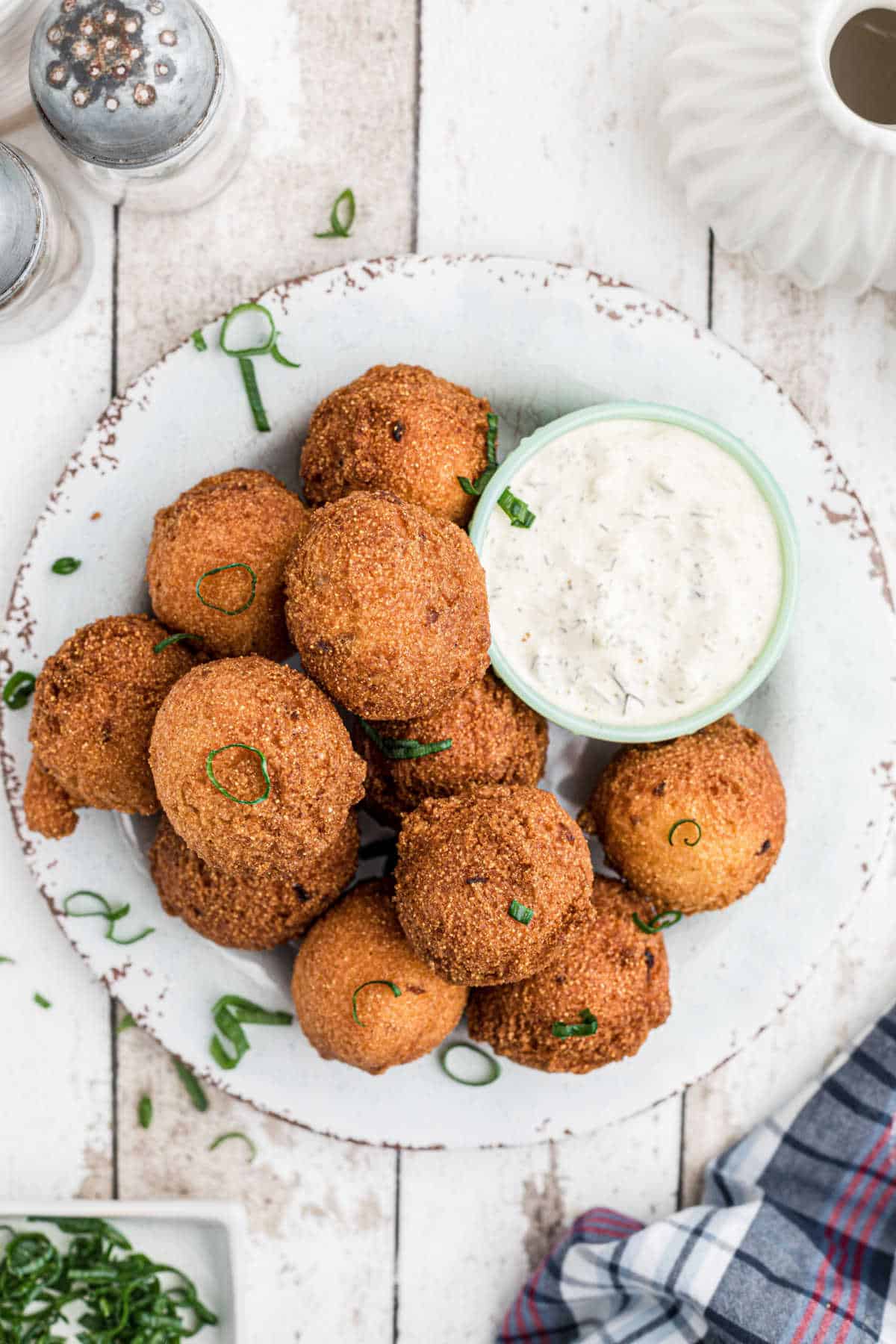 Overhead view of a plate of southern sweet hush puppies.