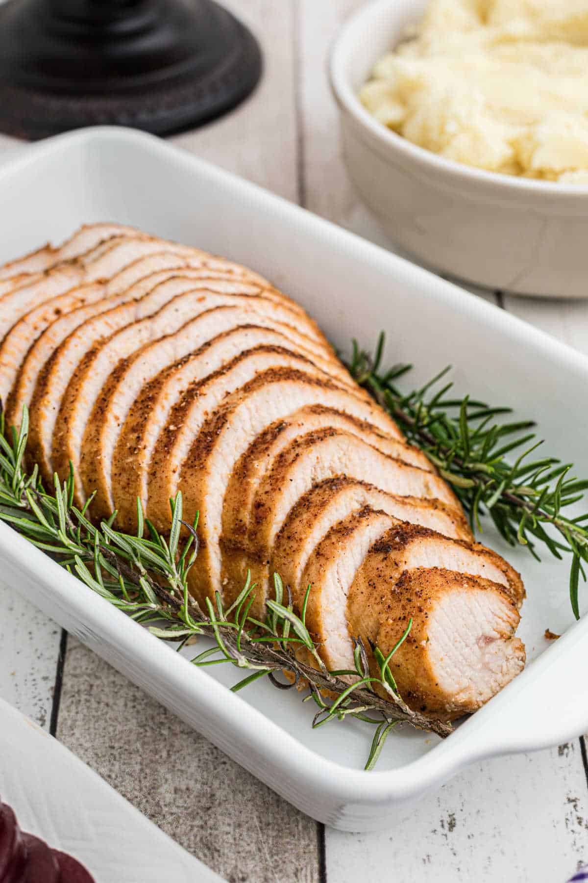 Turkey breast seasoned with cajun seasoning in a dish.