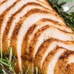 close up of some sliced cajun turkey breast with some text overlay for pinterest.