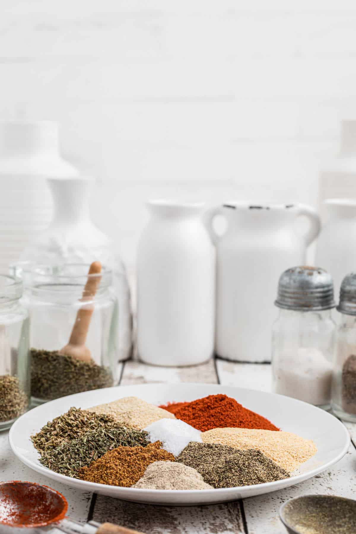 A side view of a plate full of heaps of seasoning.