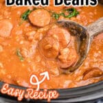 close up of a slow cooker with kielbasa and baked beans with text overlay for pinterest.