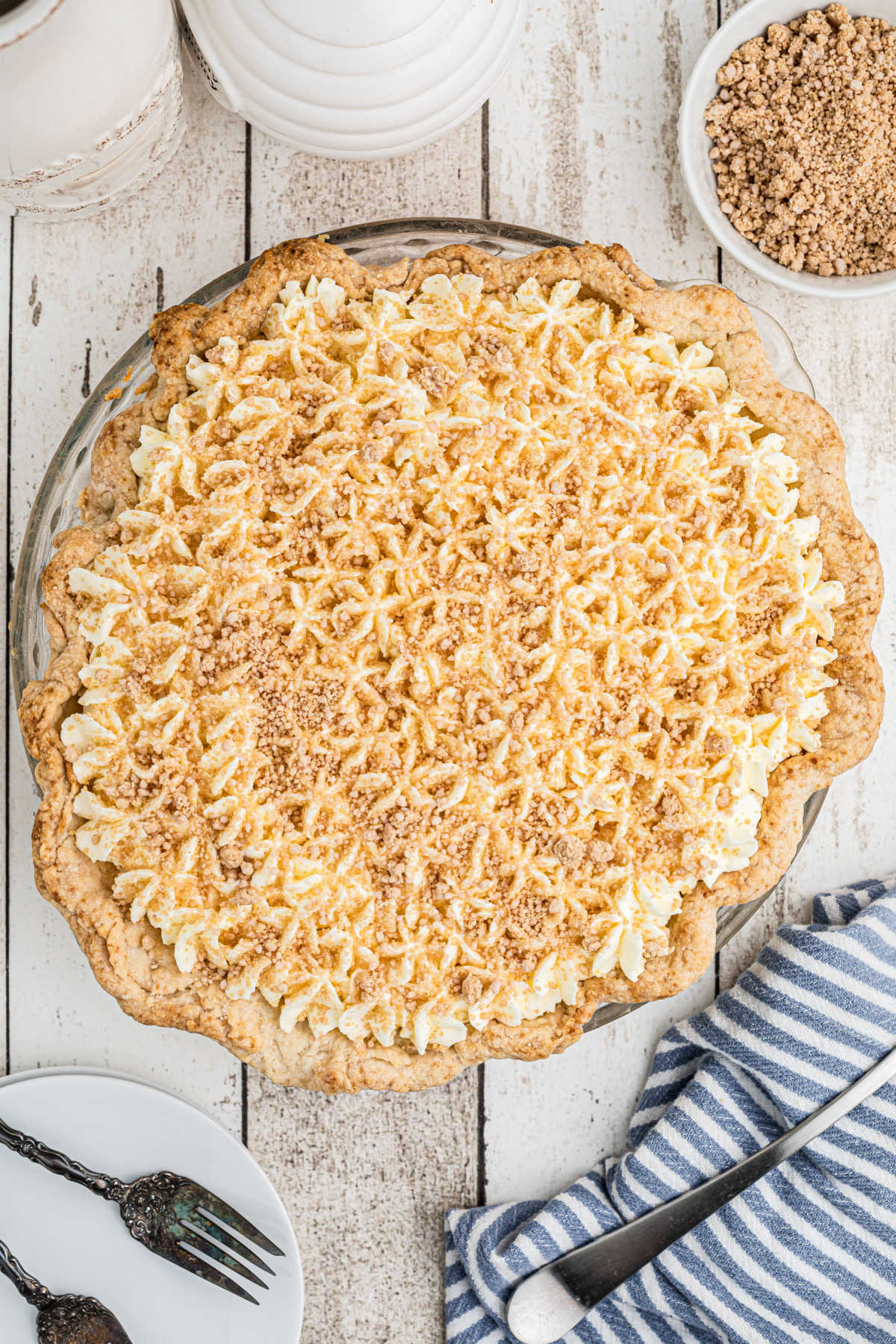 A full overhead view of a peanut butter pie with peanut butter sprinkles on top.